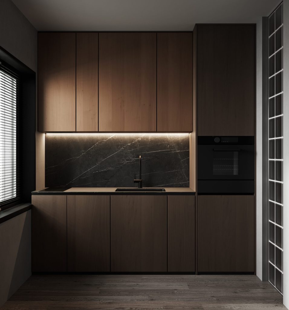 A walnut kitchen with a dark stone splashback and a built-in oven