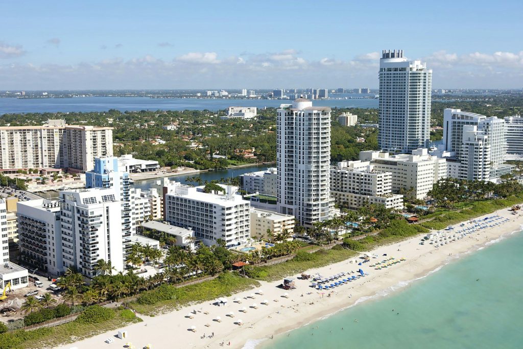 City buildings near sea during daytime
