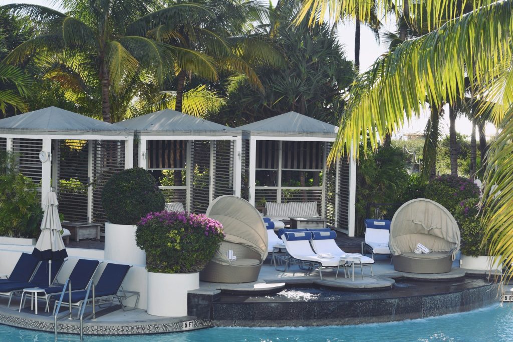 Cabanas and daybeds on a pool deck
