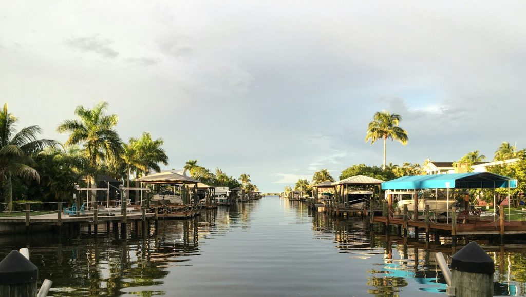 A residential canal with private docks and boat lifts