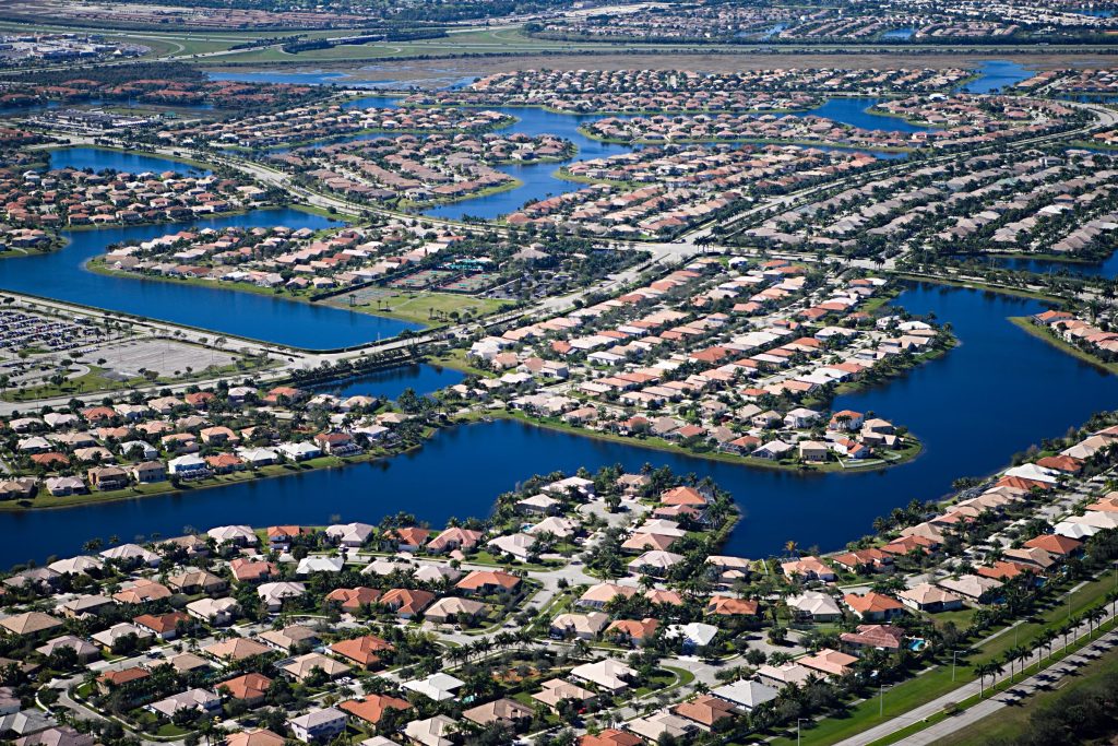 Waterfront houses arranged along a network of canals, seen from the air