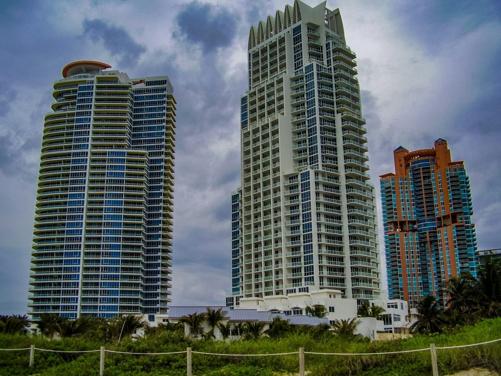 A couple of tall buildings sitting next to each other
