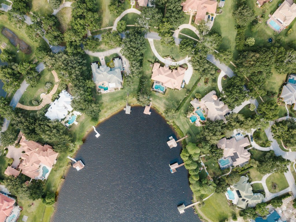 Aerial photography of body of water surrounded with buildings