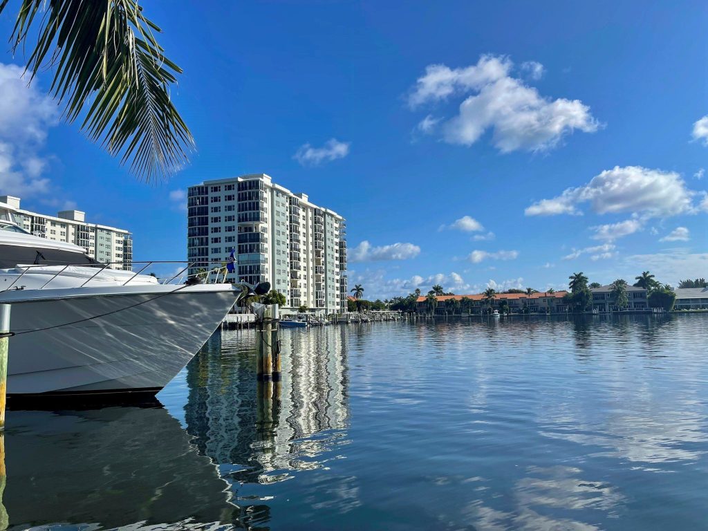 A moored yacht in front of a residential tower