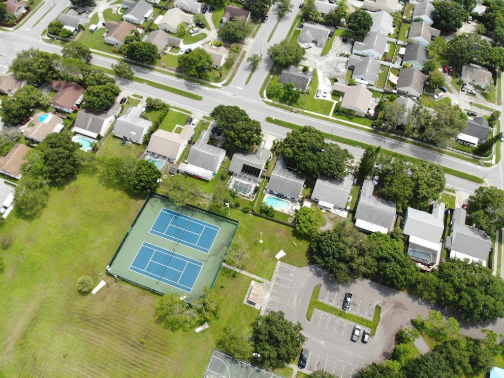 An ordinary suburban block with courts and screened pools