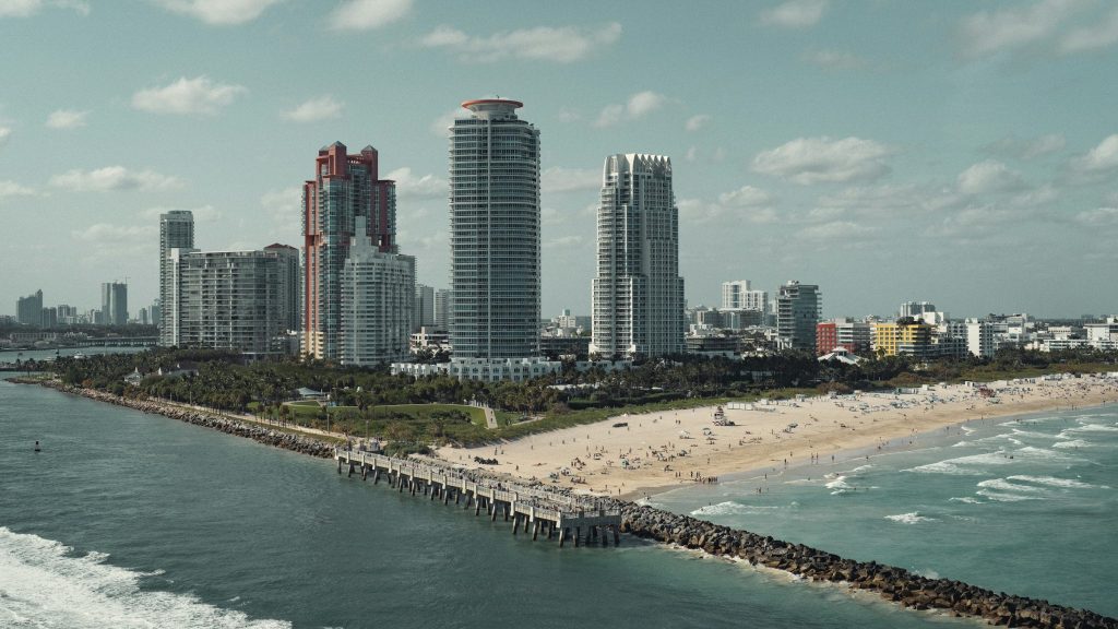 A view of a beach and a city in the background