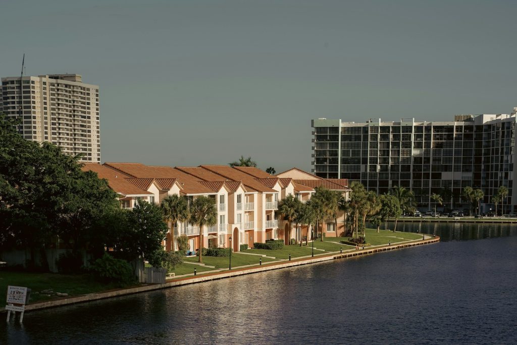 Condominium blocks on a seawall, towers behind