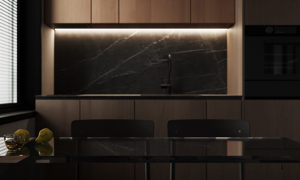 A dark walnut kitchen with a stone splashback and a built-in oven